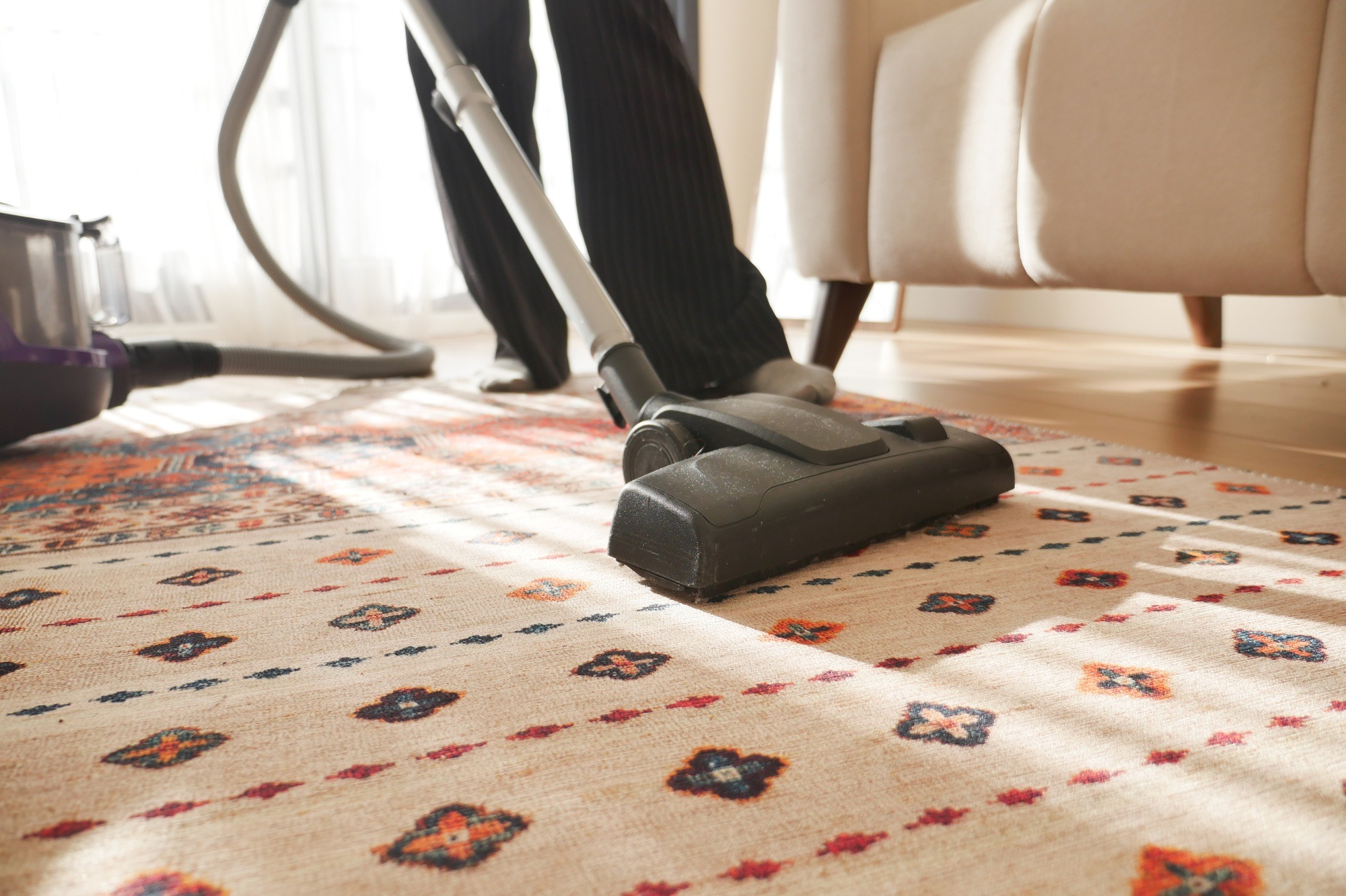 women cleaning with vacuum cleaner carpet,